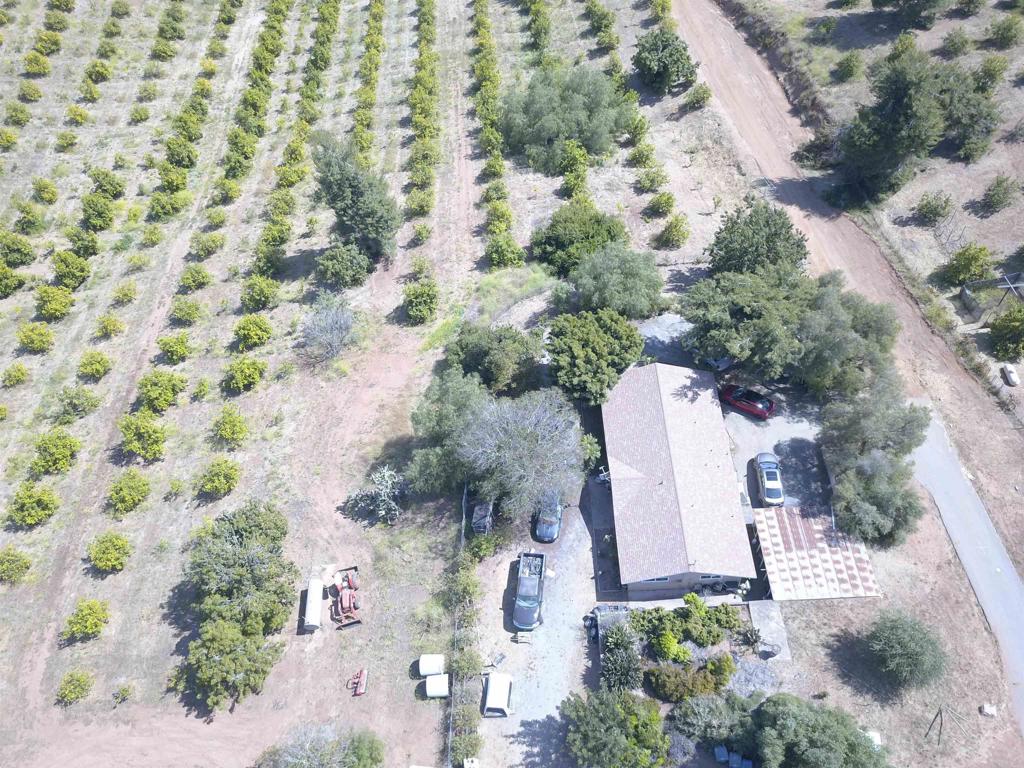 an aerial view of a house with a yard and garden