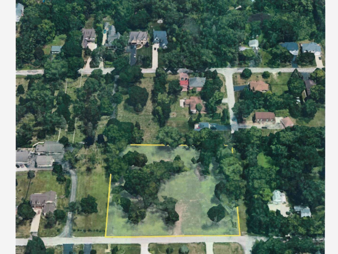 an aerial view of residential house with outdoor space and trees all around