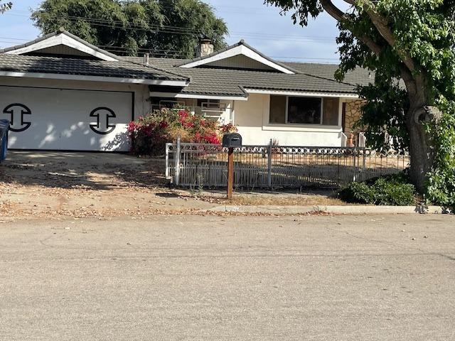 a front view of a house with garage