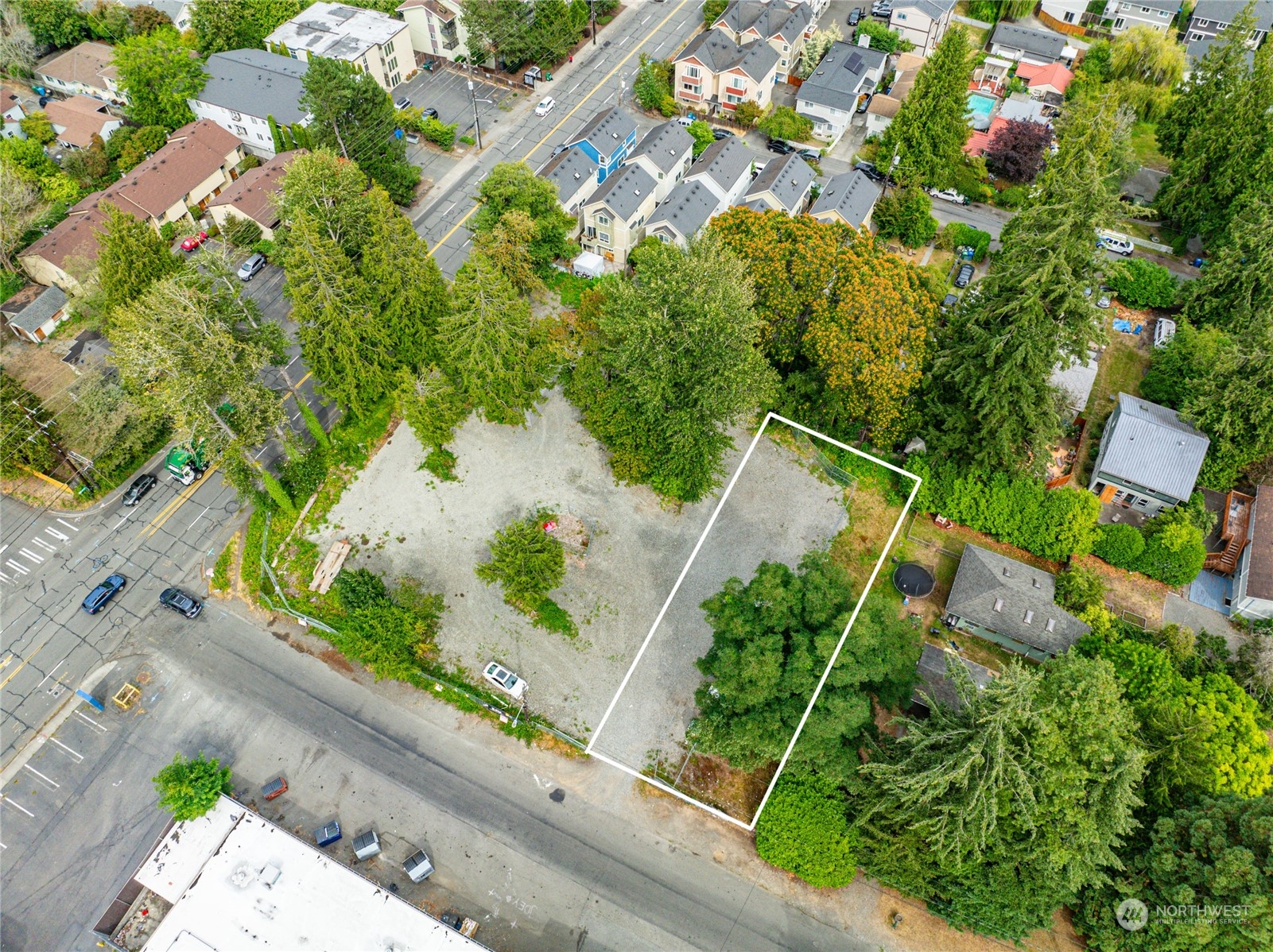 an aerial view of a house with a yard and garden