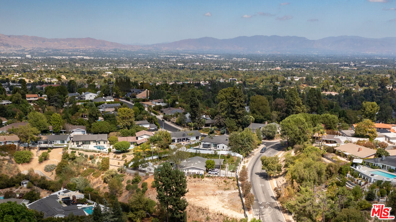 an aerial view of residential house and green space