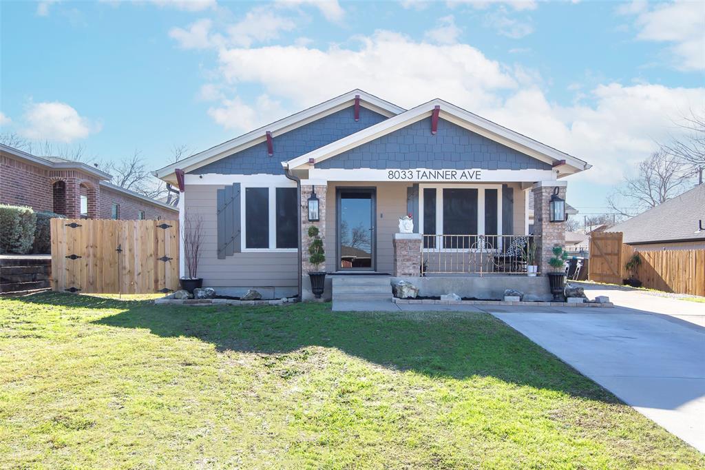 a view of a house with a yard and patio