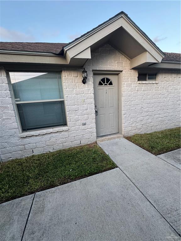 a front view of a house with garage