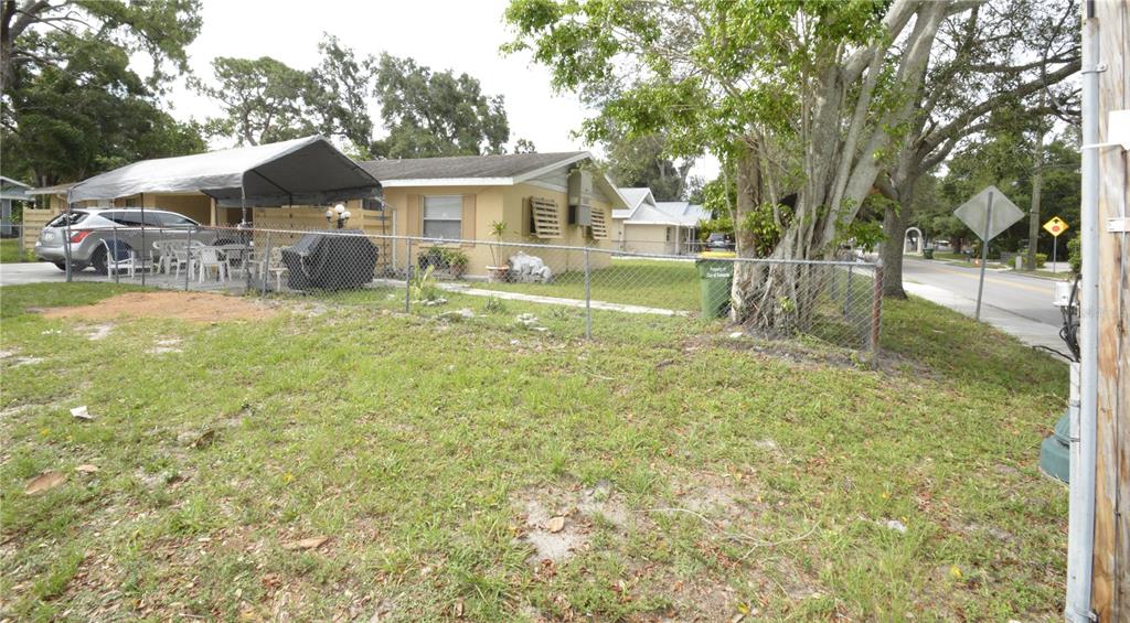 a front view of a house with yard and green space