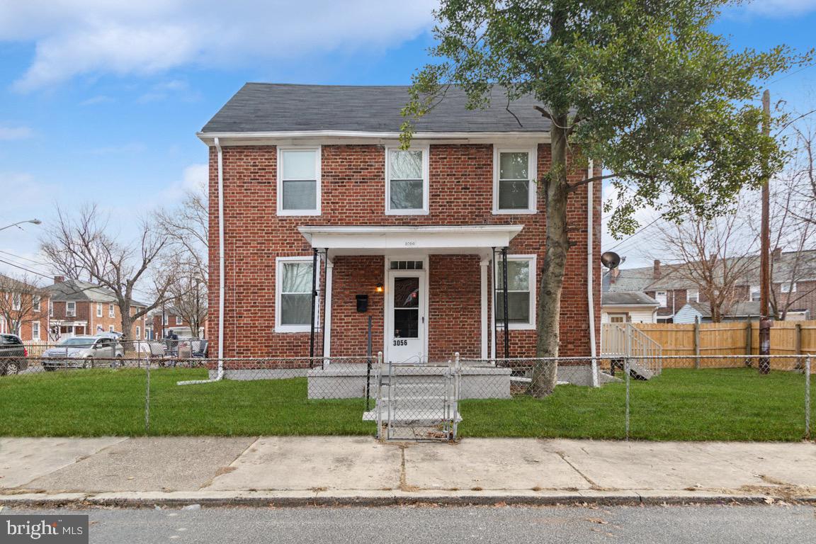 front view of a house with a yard