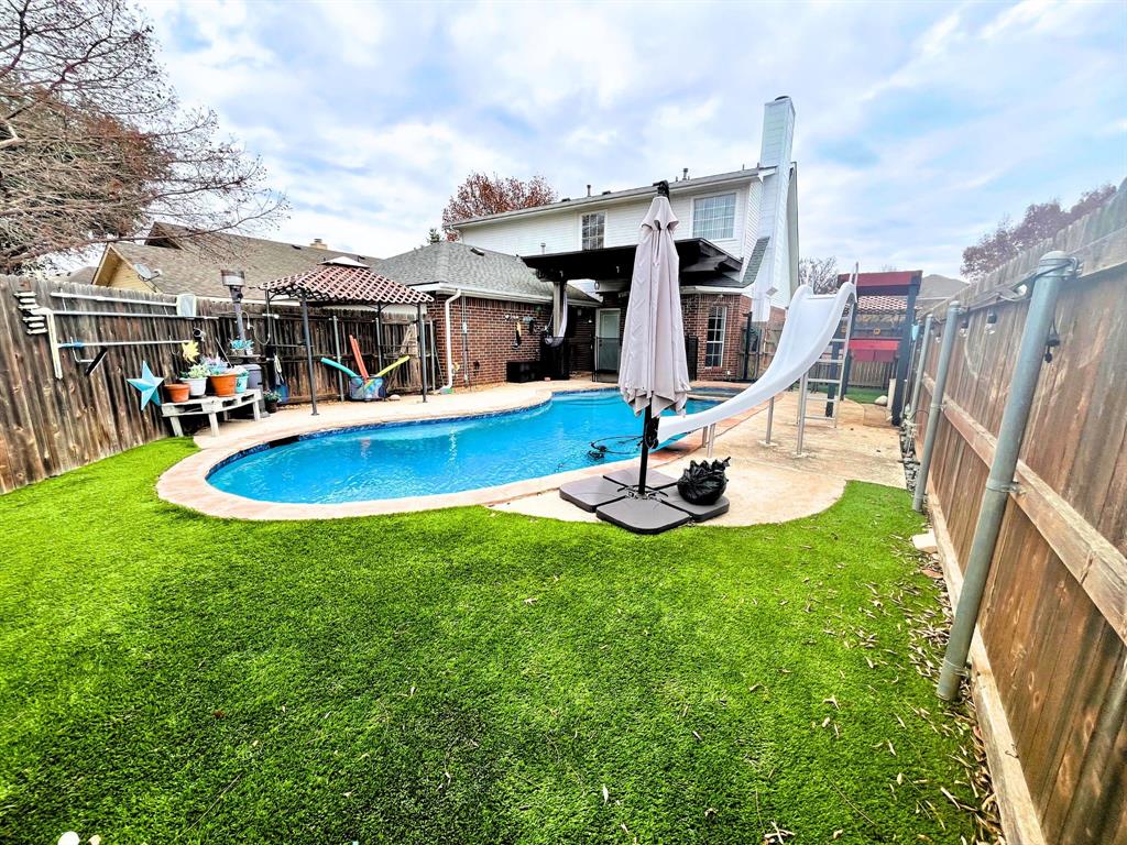 a view of outdoor space yard deck swimming pool and patio