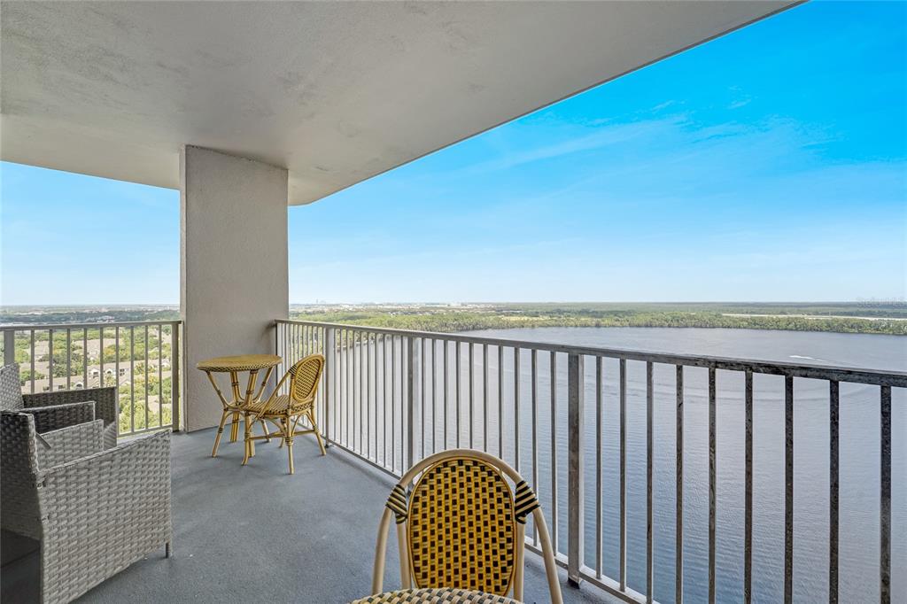 a view of balcony with furniture