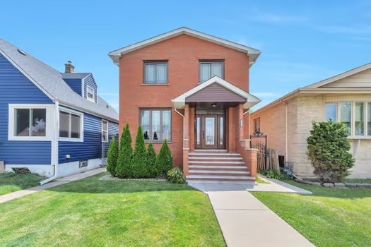 a front view of a house with a yard