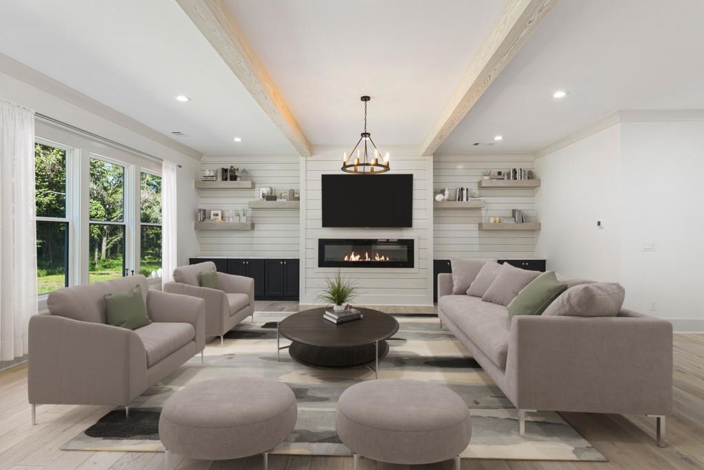 a living room with furniture a fireplace and a flat screen tv