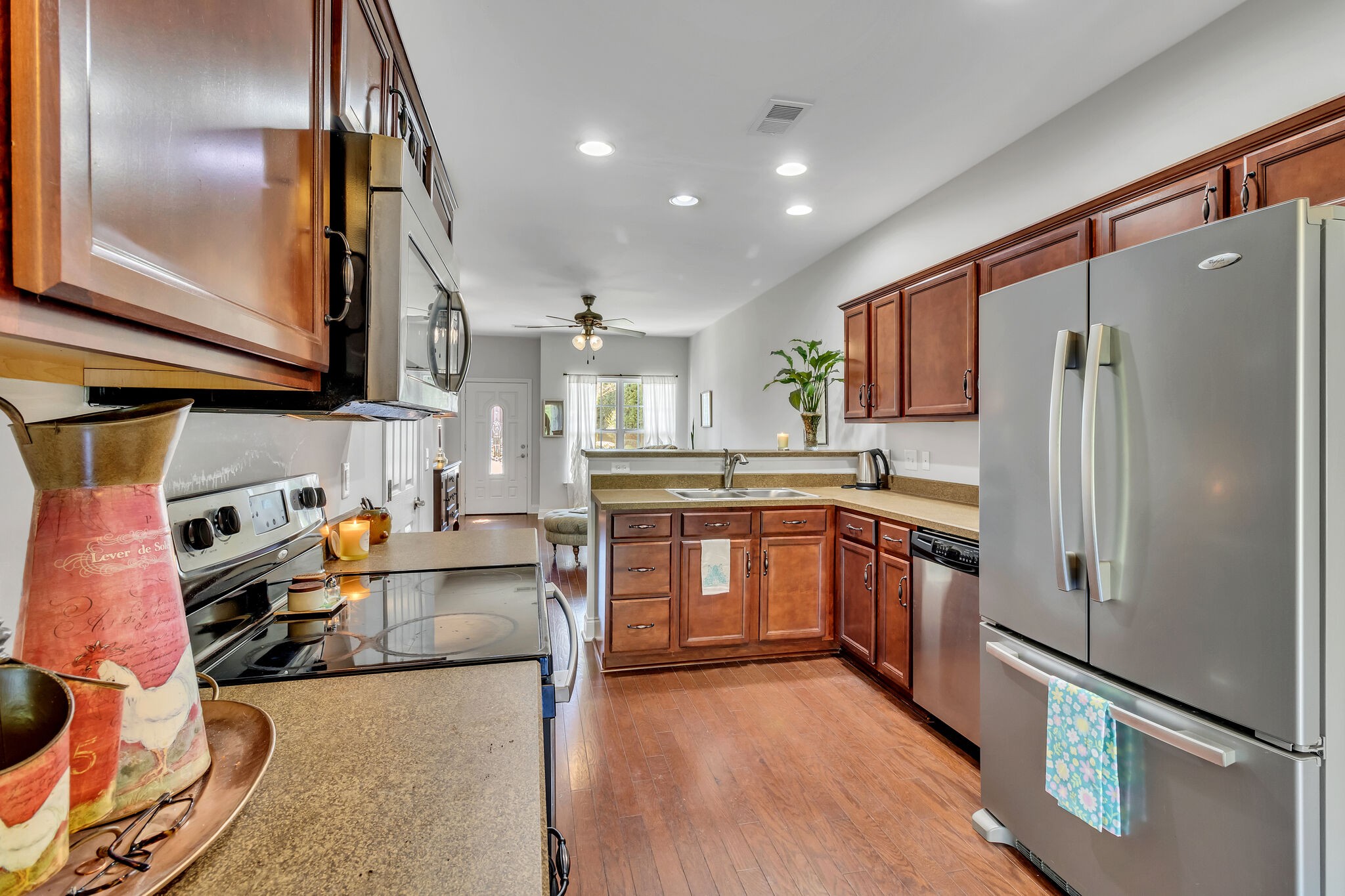 Beautiful wood cabinets with plenty of storage and separate Pantry.