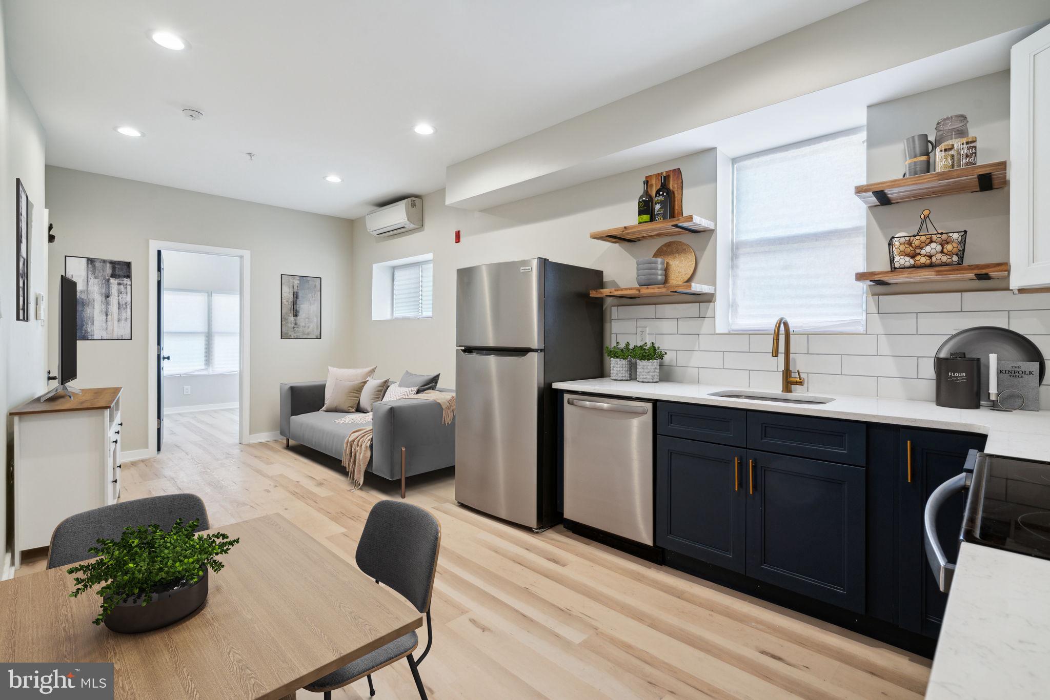 a kitchen with stainless steel appliances granite countertop a refrigerator and a sink