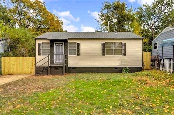 a house with trees in the background