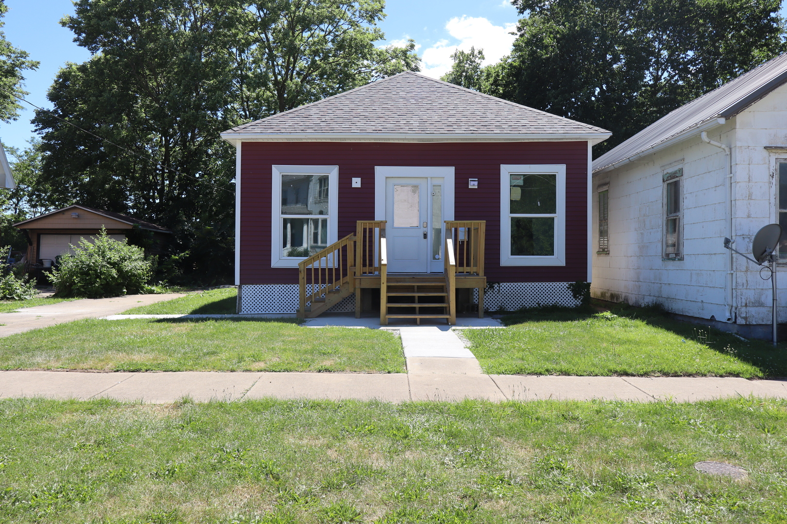 a front view of a house with garden