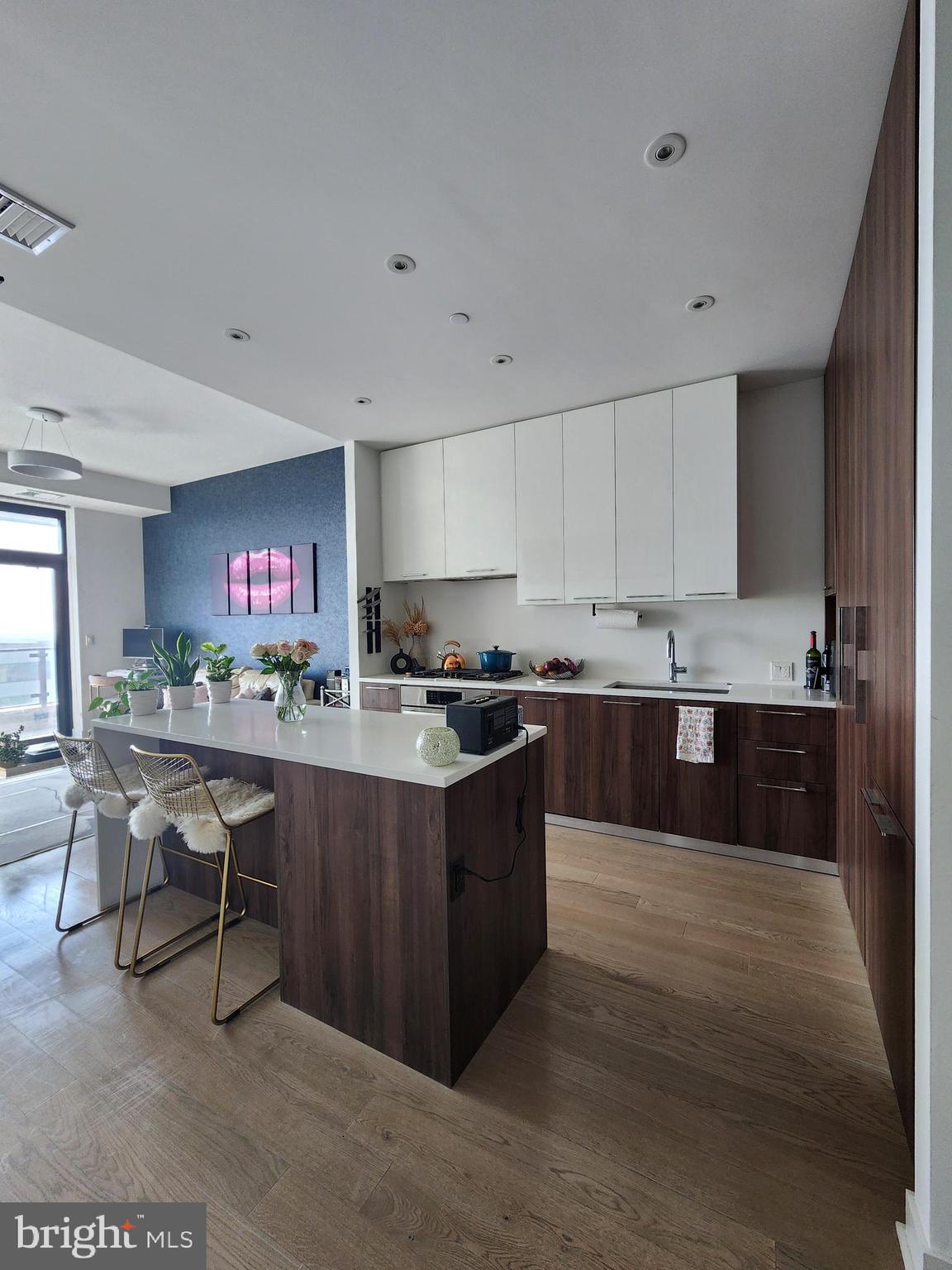 a large kitchen with lots of counter space and a sink