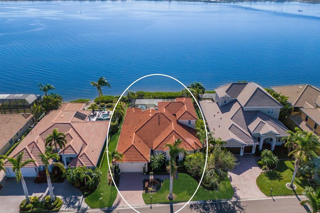 an aerial view of a house with a swimming pool