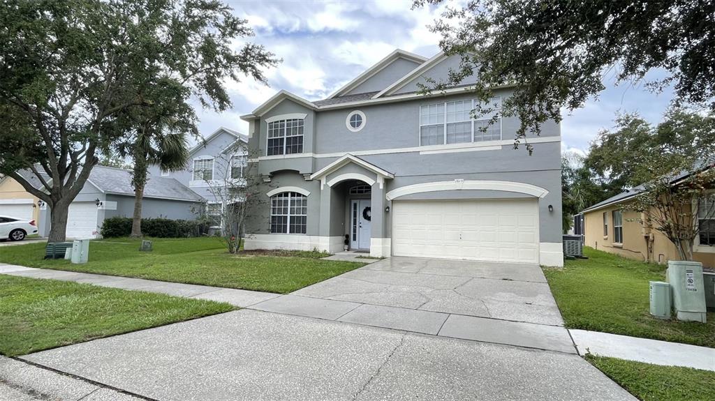 front view of a house with a yard