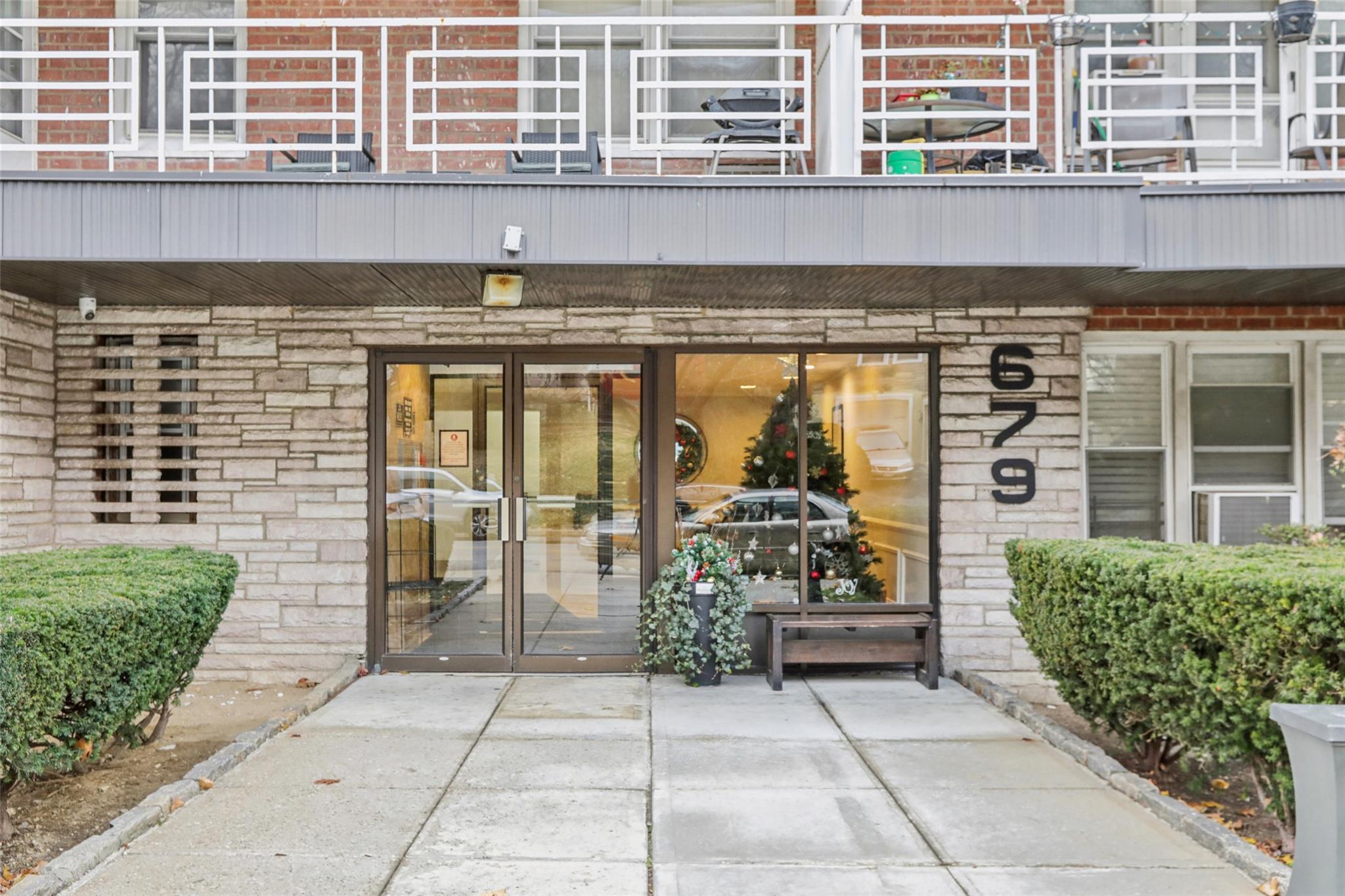 Doorway to property featuring a balcony and a patio area