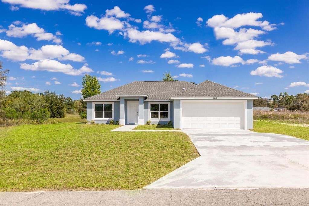 a front view of a house with yard