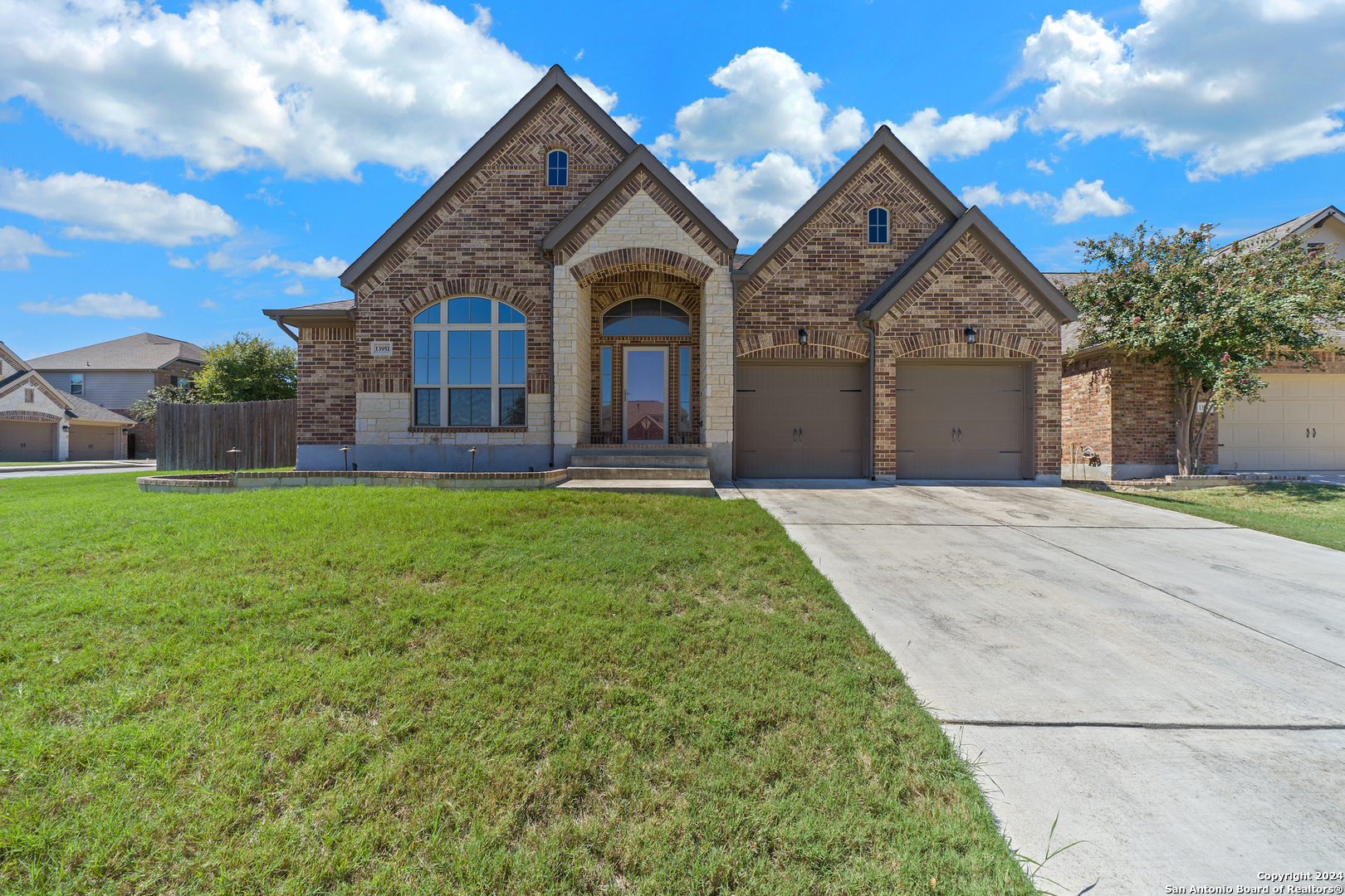 a front view of a house with a yard