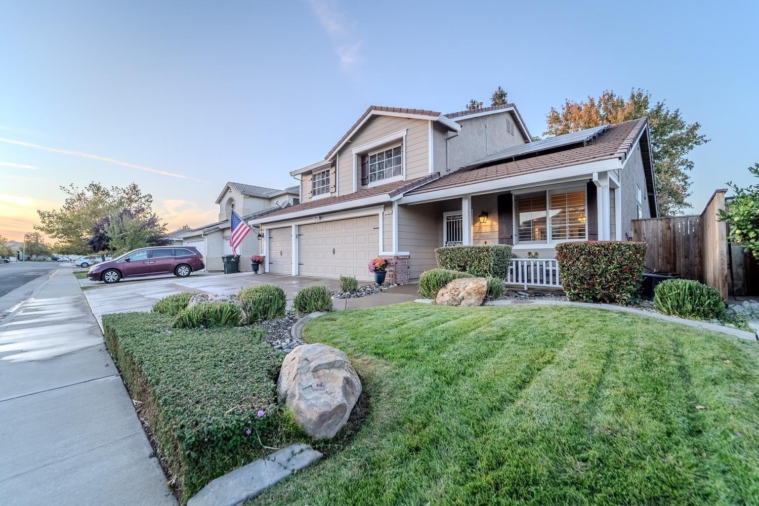 a front view of a house with garden