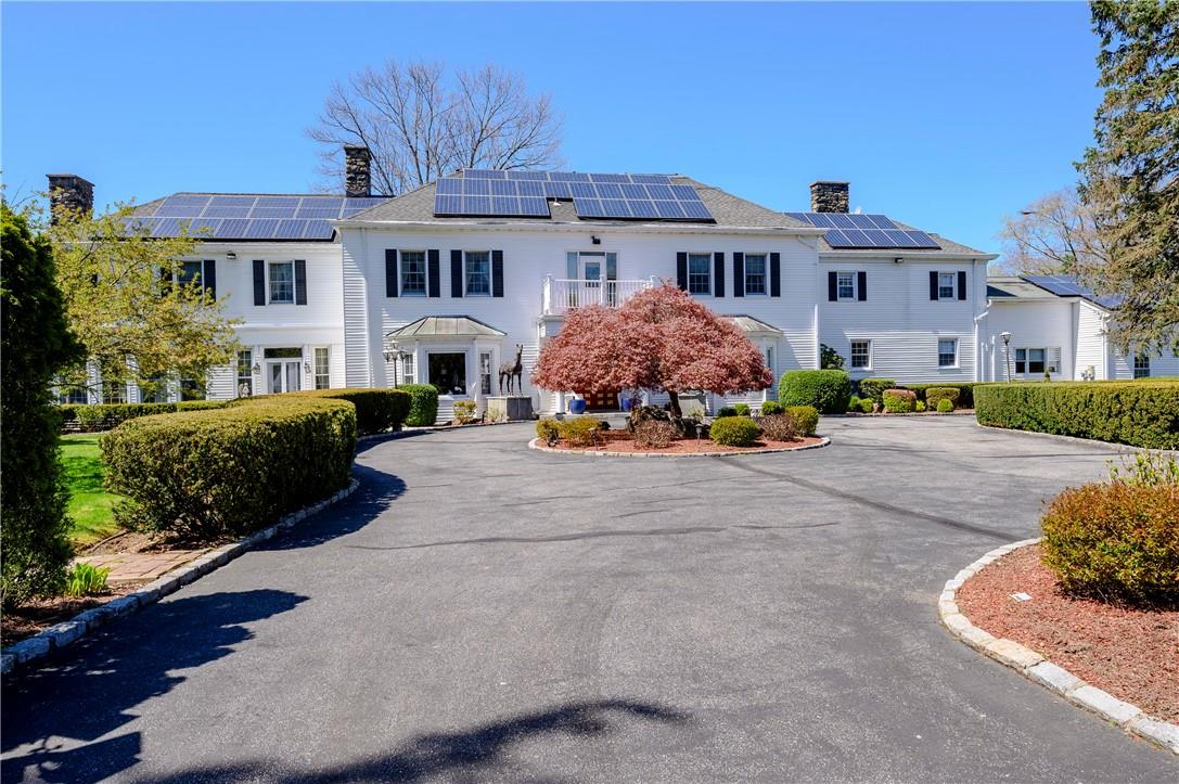 View of front of property with solar panels