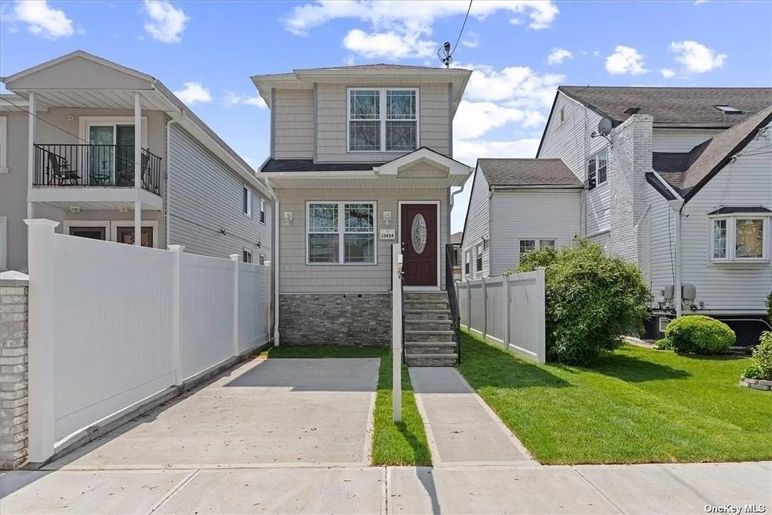 View of front of home featuring a balcony