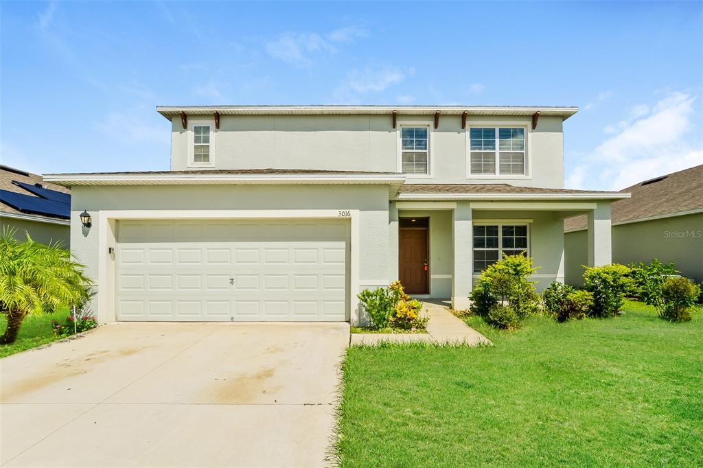 front view of a house with a yard