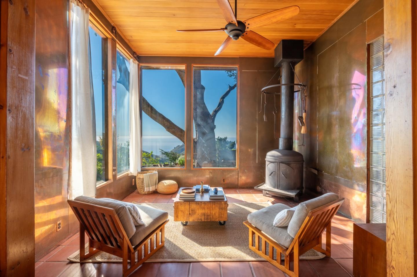 a balcony with table and chairs