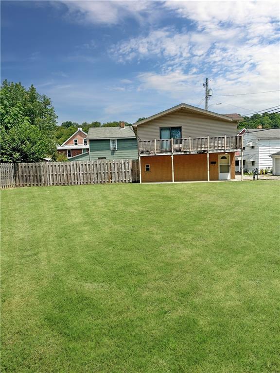 a view of a big room with a big yard and plants