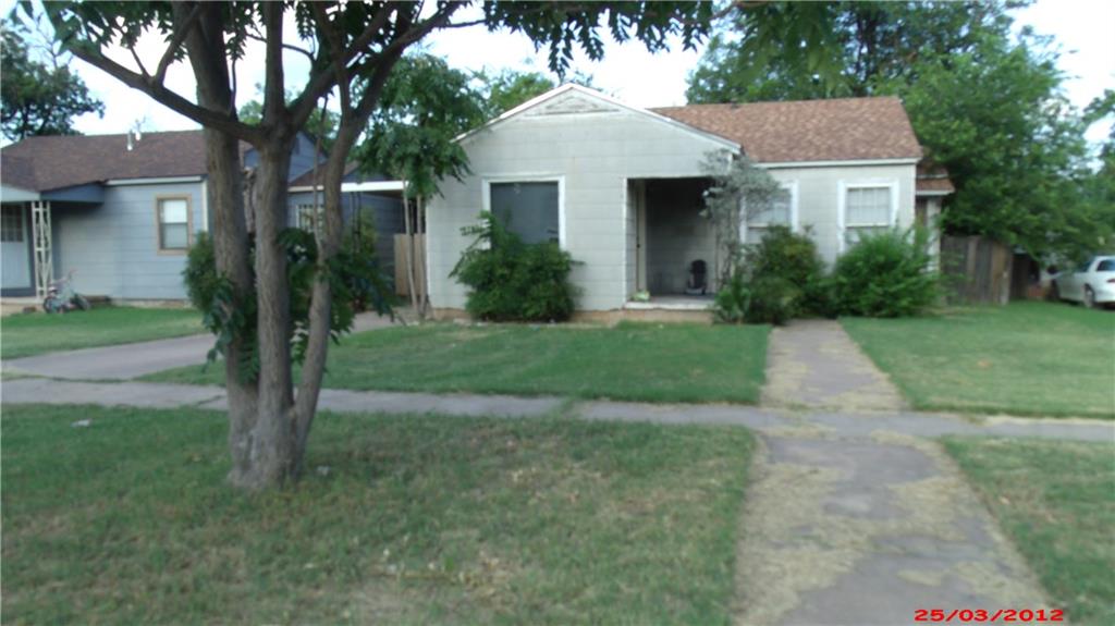 a front view of a house with yard