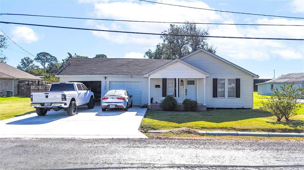 a front view of a house with swimming pool and porch