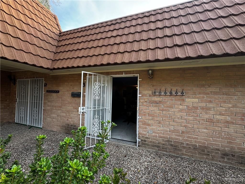 a front view of a house with a large window