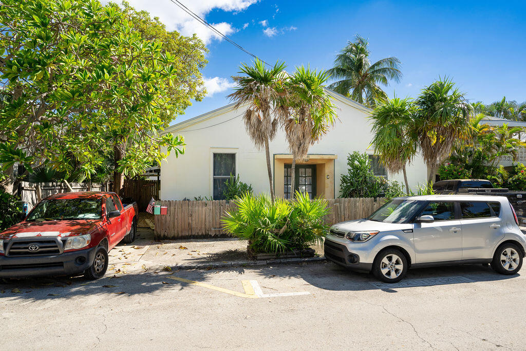 a view of a car parked in front of a house