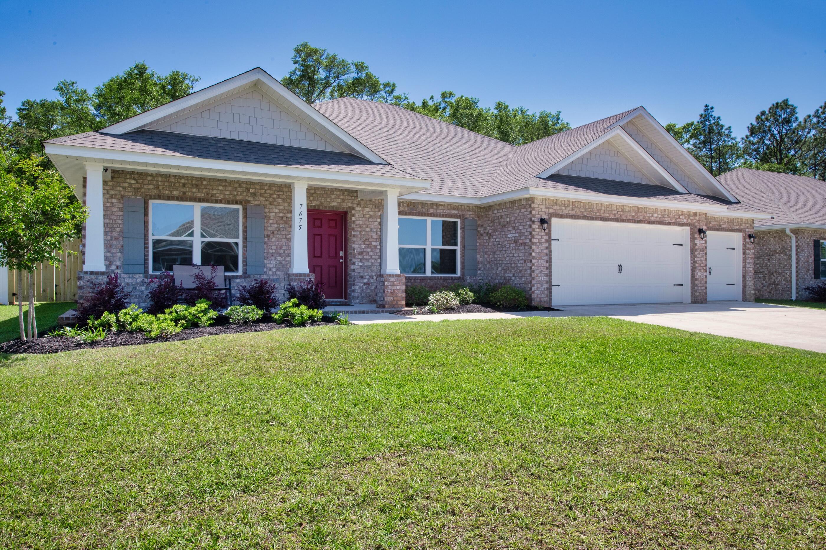 front view of a house with a yard