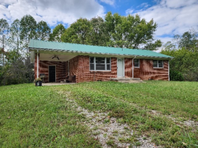 front view of a house with a yard