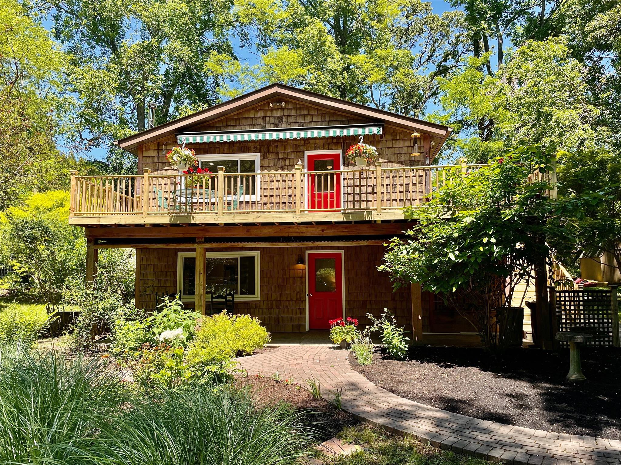 View of front of house with a deck