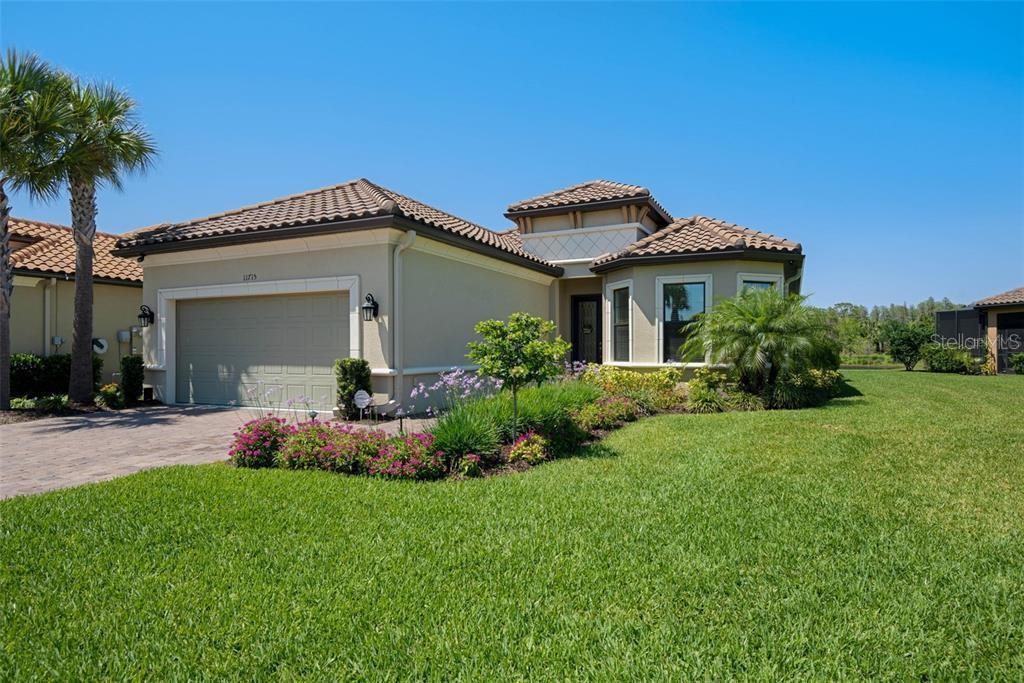 a front view of a house with garden