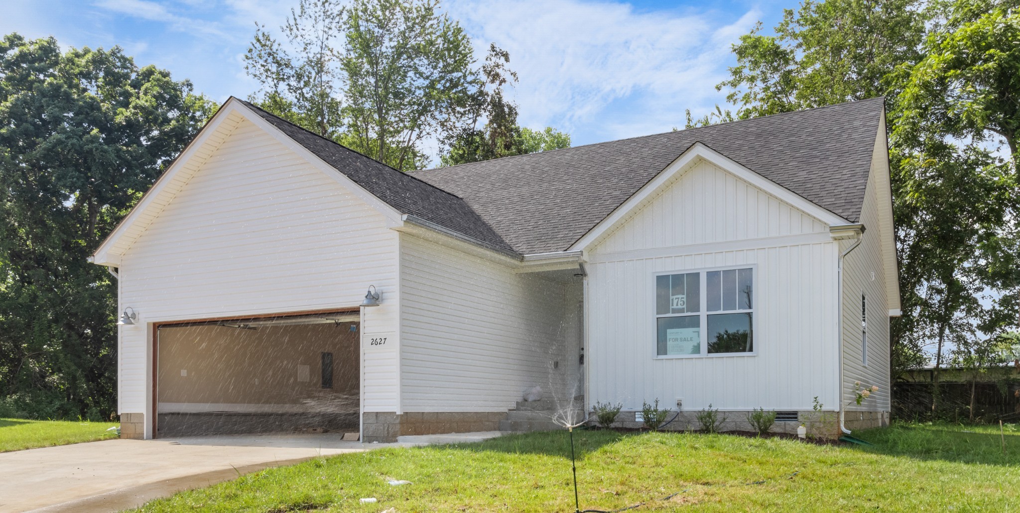 a view of backyard of house with garage