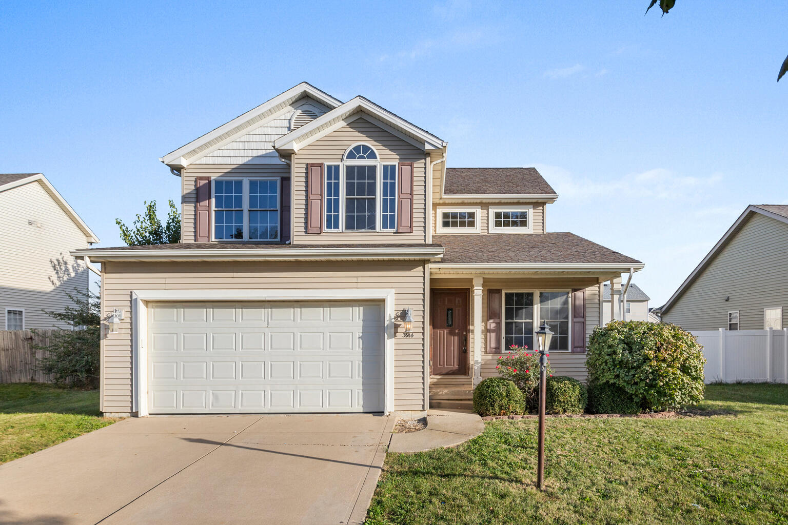 front view of a house with a yard