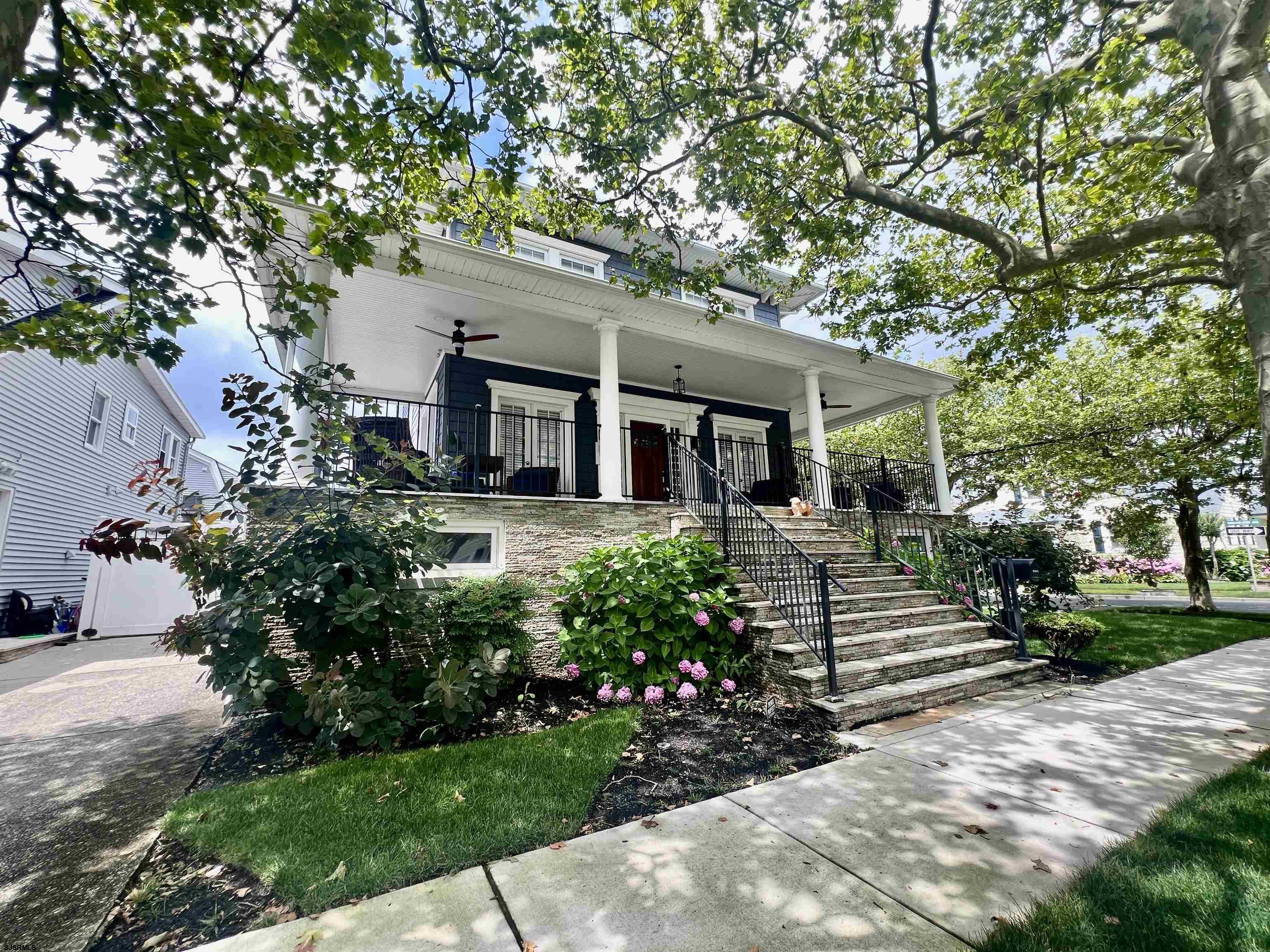 front view of a house with a garden