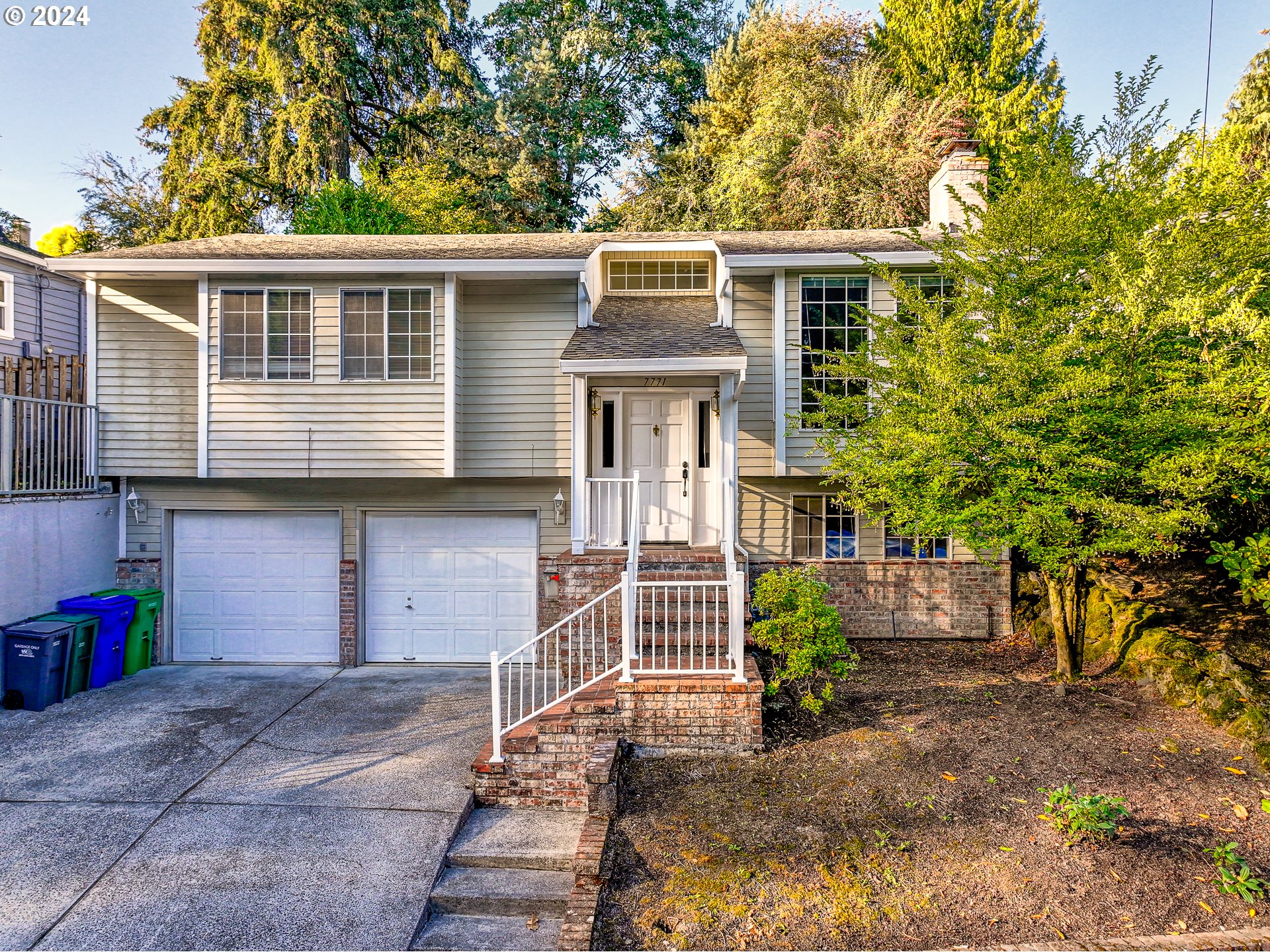 a front view of a house with a garage