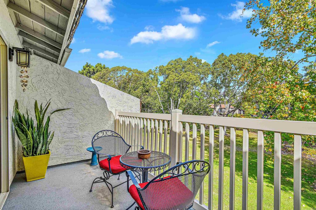 a view of balcony with two chairs and a table