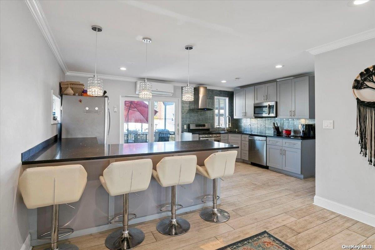 a kitchen with stainless steel appliances granite countertop a refrigerator and microwave