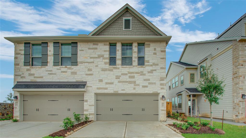 a front view of a house with a garage