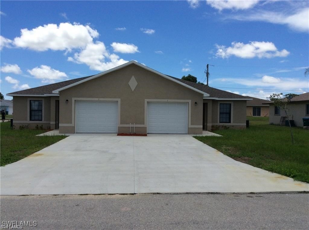 front view of a house with a yard