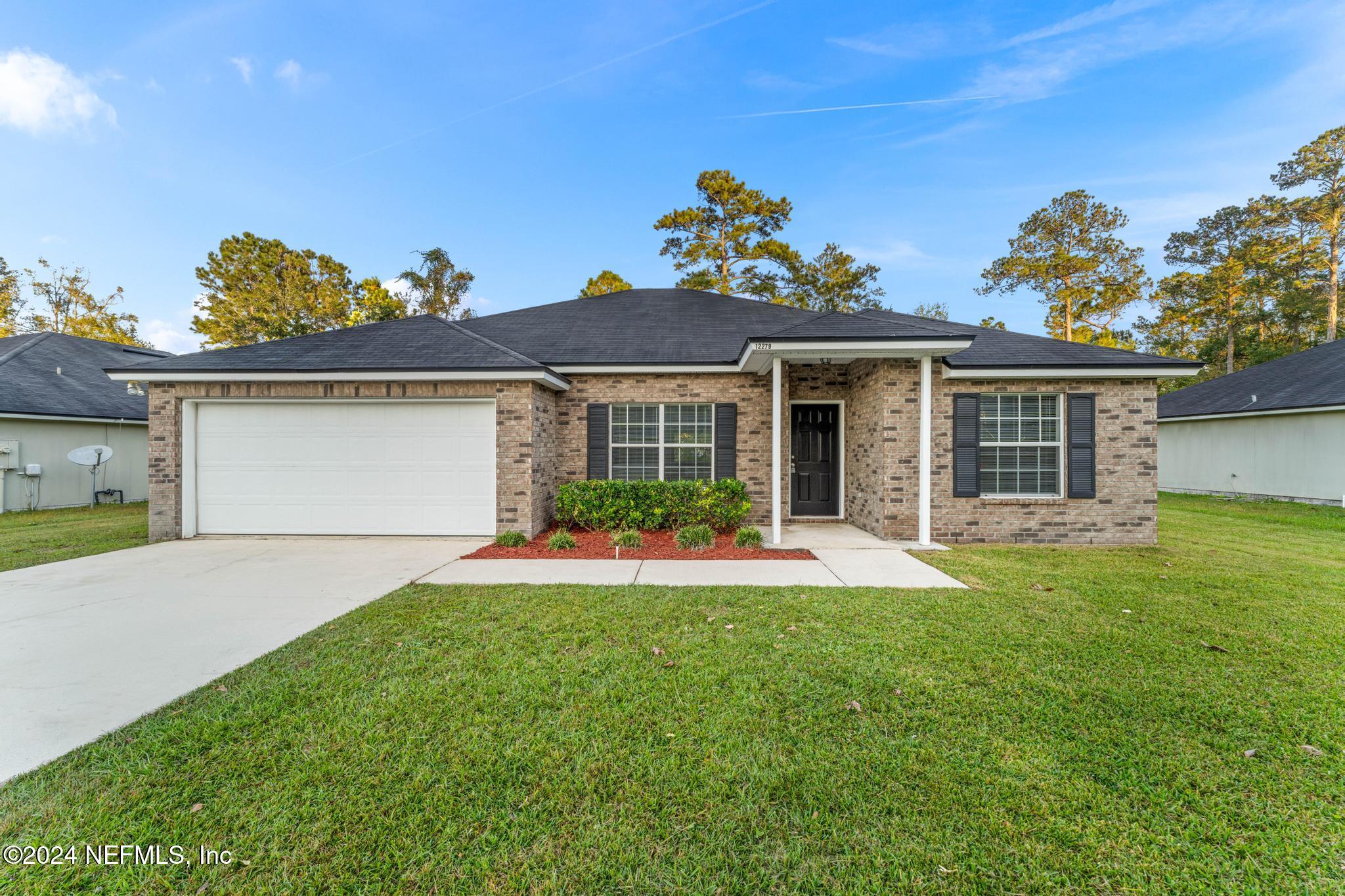 front view of a house with a yard