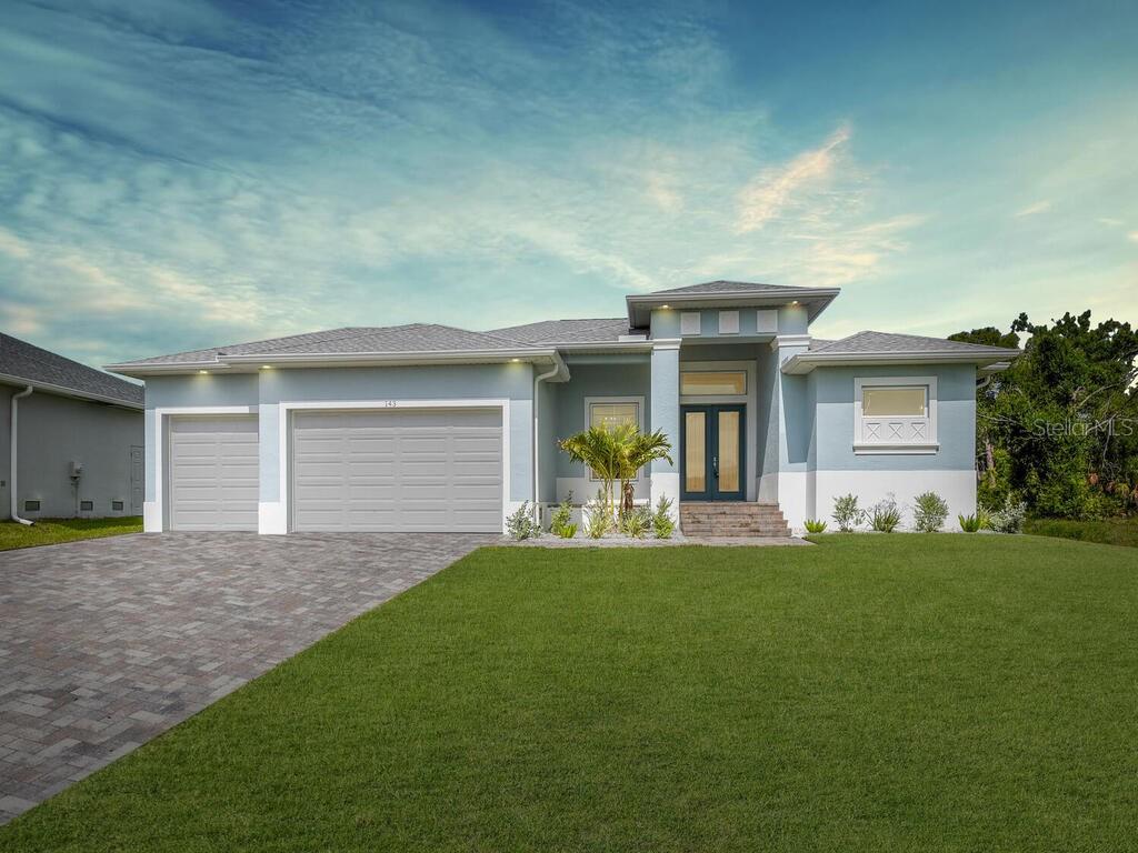 a front view of a house with a yard and garage