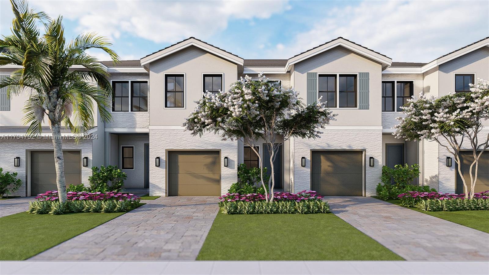 a front view of a house with a garden and yard