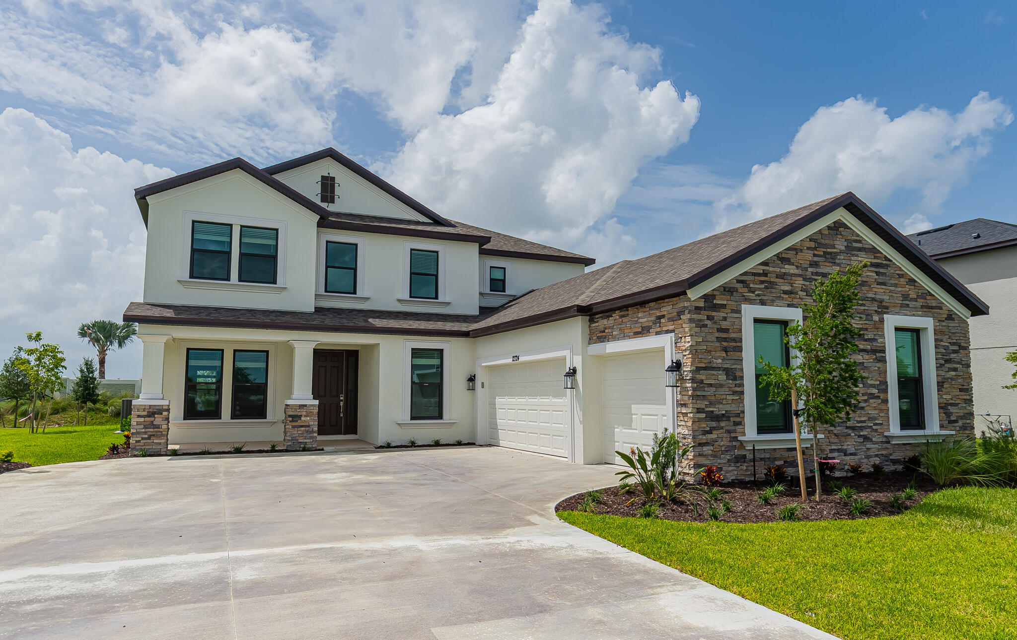 front view of a house with a yard