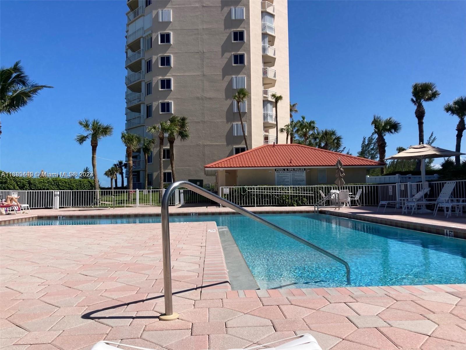 a view of pool with outdoor seating